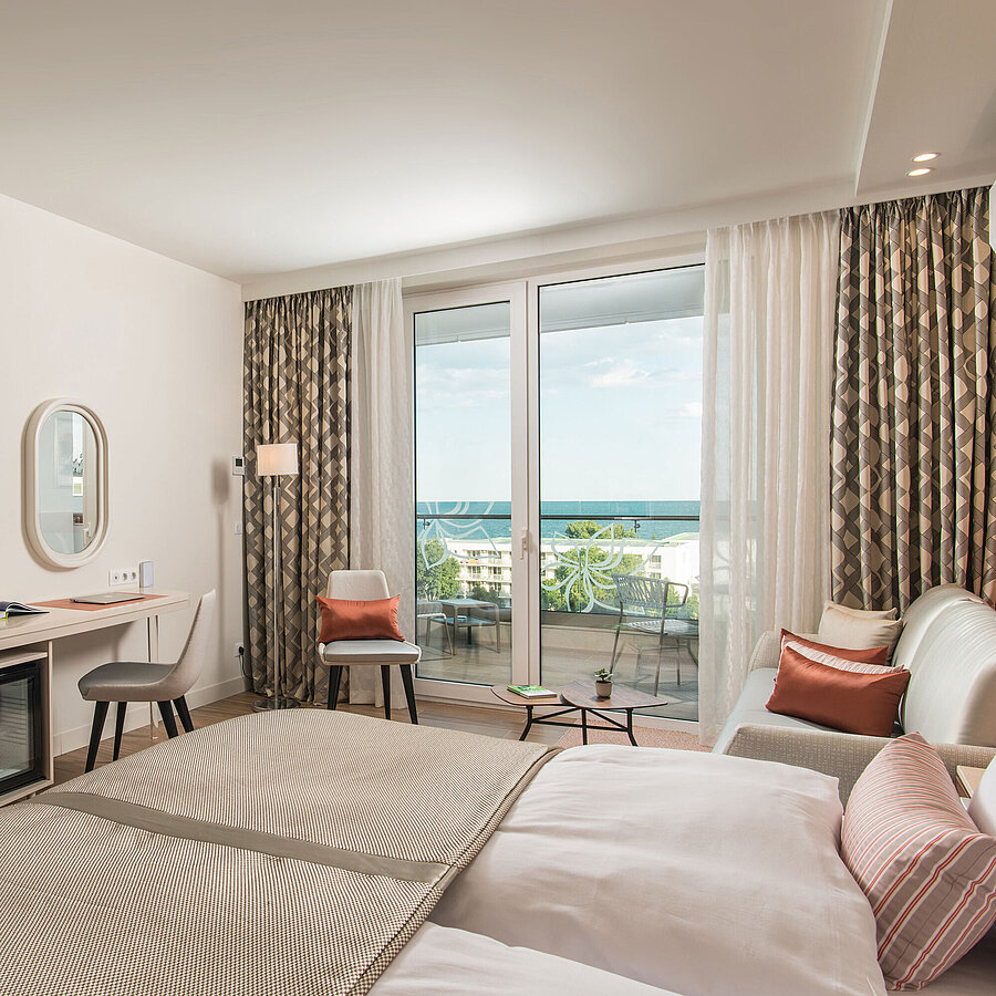 Executive room Bright room at Maritim Hotel Amelia with desk, seating area and balcony view of the sea